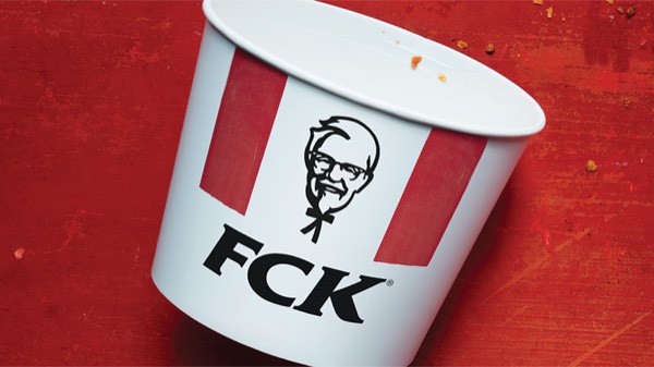 KFC's FCK ad: an empty KFC bucket on a red surface with the logo letters rearranged to spell FCK
